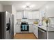 Renovated kitchen with white cabinets and stainless steel appliances at 3460 Fairlane Dr, Atlanta, GA 30331