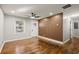 Open living area with hardwood floors and wood accent wall at 3460 Fairlane Dr, Atlanta, GA 30331