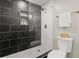 Modern shower with dark tile and glass enclosure at 3460 Fairlane Dr, Atlanta, GA 30331