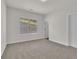 Spacious bedroom with gray carpet, window, and closet at 399 Tillman Pass, Woodstock, GA 30188