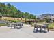 Outdoor kitchen and dining area with grills and seating at 399 Tillman Pass, Woodstock, GA 30188