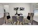 Elegant dining area with glass-top table and statement chairs at 399 Tillman Pass, Woodstock, GA 30188