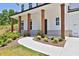 Covered front porch with wooden columns and a walkway leading to the entrance at 399 Tillman Pass, Woodstock, GA 30188