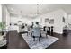 Modern kitchen with white cabinets, granite countertops, and stainless steel appliances at 399 Tillman Pass, Woodstock, GA 30188