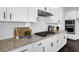 Kitchen with granite countertops and stainless steel appliances at 399 Tillman Pass, Woodstock, GA 30188