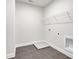 Laundry room with shelving, drain, and tile floor at 399 Tillman Pass, Woodstock, GA 30188