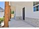 Front porch with wooden posts and brick accents at 399 Tillman Pass, Woodstock, GA 30188