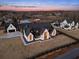 Aerial view of a community of farmhouses with large lots and a red barn at 5180 Howard Rd, Cumming, GA 30040