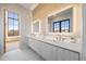 Modern bathroom with marble and wood vanity at 5180 Howard Rd, Cumming, GA 30040