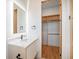 Modern bathroom with a floating vanity and walk-in closet at 5180 Howard Rd, Cumming, GA 30040