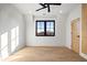 Light and airy bedroom with hardwood floors and ceiling fan at 5180 Howard Rd, Cumming, GA 30040