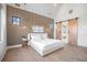 Spacious primary bedroom with wood wall accents and barn door at 5180 Howard Rd, Cumming, GA 30040