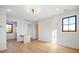 Well-lit bedroom with a contemporary ceiling fan, wood floors, and large windows at 5180 Howard Rd, Cumming, GA 30040