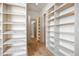 Large walk-in closet with ample shelving and drawers at 5180 Howard Rd, Cumming, GA 30040