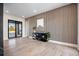 Light-filled entry showcasing wood feature wall and hardwood floors at 5180 Howard Rd, Cumming, GA 30040