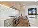 Modern kitchen with marble countertops, stainless steel appliances, and ample cabinet space at 5180 Howard Rd, Cumming, GA 30040