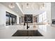 Modern kitchen island with large sink and marble countertop at 5180 Howard Rd, Cumming, GA 30040