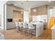 Modern kitchen with light wood cabinets, white countertops, and island with seating at 5180 Howard Rd, Cumming, GA 30040