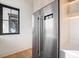 Modern kitchen with stainless steel refrigerator and wood cabinets at 5180 Howard Rd, Cumming, GA 30040