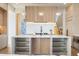 Contemporary kitchen island with ample storage and modern lighting at 5180 Howard Rd, Cumming, GA 30040