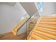 Modern staircase with glass railings and LED lighting at 5180 Howard Rd, Cumming, GA 30040