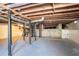 Unfinished basement with exposed wooden ceiling and metal support beams at 3002 Arabian Woods Dr, Lithonia, GA 30038