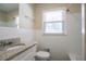 Bright bathroom features white tile and granite countertop on the vanity at 3002 Arabian Woods Dr, Lithonia, GA 30038