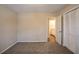 Bedroom with neutral carpet, large closet, and view into connected bath at 3002 Arabian Woods Dr, Lithonia, GA 30038