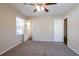 Well-lit bedroom with new carpeting, neutral walls, and white doors at 3002 Arabian Woods Dr, Lithonia, GA 30038
