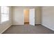 Bright bedroom featuring a large window and plush carpeting at 3002 Arabian Woods Dr, Lithonia, GA 30038
