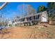 Charming home with attached garage, landscaped yard, and inviting front porch at 3002 Arabian Woods Dr, Lithonia, GA 30038