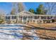 Charming brick home featuring a covered front porch and landscaped front yard at 3002 Arabian Woods Dr, Lithonia, GA 30038