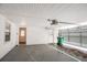 Spacious two car garage featuring an automatic door opener, a single hung window and a side entrance at 3002 Arabian Woods Dr, Lithonia, GA 30038
