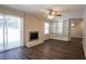 Spacious living room featuring a fireplace, built-in shelves, and wood flooring at 3002 Arabian Woods Dr, Lithonia, GA 30038