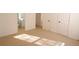 Neutral bedroom featuring plush carpeting and a view into an ensuite bath at 4259 Creek Haven Dr, Marietta, GA 30062