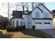 Charming two-story traditional home with a two-car garage, manicured lawn, and mature trees at 4259 Creek Haven Dr, Marietta, GA 30062