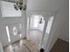 Grand two-story foyer with decorative tile flooring, ornate columns, and elegant chandeliers at 4259 Creek Haven Dr, Marietta, GA 30062