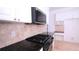 Kitchen featuring granite counters, stainless steel appliances, and tiled backsplash at 4259 Creek Haven Dr, Marietta, GA 30062