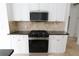 Well-equipped kitchen featuring a modern gas range, stainless steel microwave, and granite countertops at 4259 Creek Haven Dr, Marietta, GA 30062