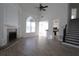 Spacious living room featuring a fireplace, large window, and hardwood floors at 4259 Creek Haven Dr, Marietta, GA 30062