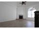 Open-concept living room with fireplace, wood flooring, and a large arched window at 4259 Creek Haven Dr, Marietta, GA 30062