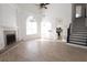 Spacious living room with wood floors, fireplace, and staircase access to the second floor at 4259 Creek Haven Dr, Marietta, GA 30062
