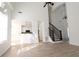 Bright, open living area with soaring ceilings, wood floors, and access to a modern kitchen at 4259 Creek Haven Dr, Marietta, GA 30062