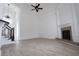 Sunlit living room with wood floors, fireplace, and a view into the foyer at 4259 Creek Haven Dr, Marietta, GA 30062