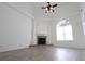Living room featuring wood flooring, fireplace, and arched window at 4259 Creek Haven Dr, Marietta, GA 30062
