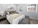 Bright bedroom with a queen bed, window, and gray accents at 2301 Troy Cove Rd, Decatur, GA 30035