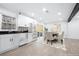 Modern kitchen with white cabinets, stainless steel appliances, and a breakfast area at 2301 Troy Cove Rd, Decatur, GA 30035