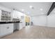 Modern white kitchen with dark countertops and sliding glass door access at 2301 Troy Cove Rd, Decatur, GA 30035