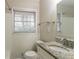 Bathroom featuring a granite vanity, white tile, and a window with blinds at 2405 County Line Sw Rd, Atlanta, GA 30331