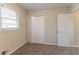 Bedroom featuring a window with blinds, plush carpet, and neutral paint at 2405 County Line Sw Rd, Atlanta, GA 30331